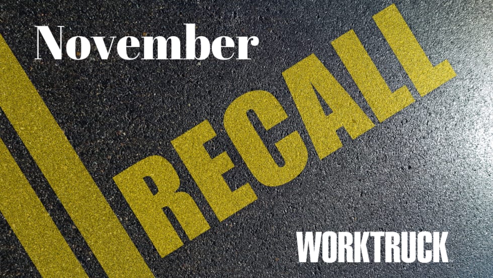 Pavement background with double yellow lines and large text that says Recall, November, and Work Truck logo.