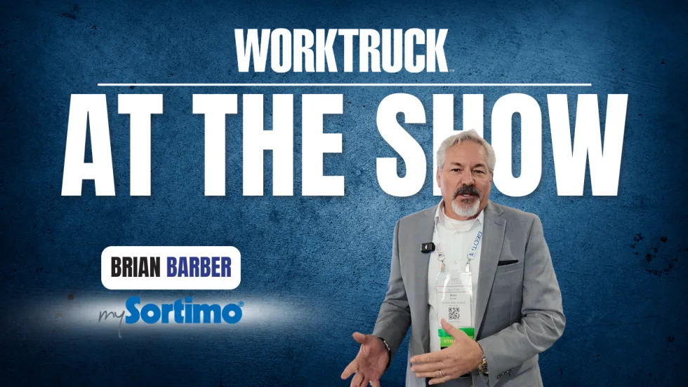Work Truck At The Show graphic featuring Brian Barber of Sortimo standing beside bold text on a blue background, speaking on camera about commercial vehicle upfitting.