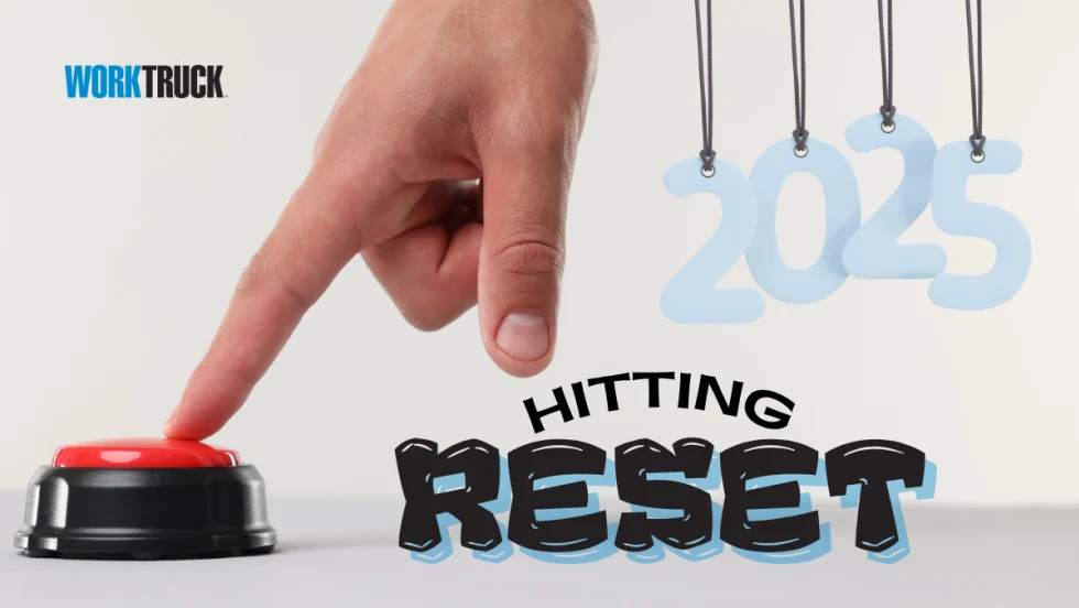 Hand hitting a button with 2025 Hitting Reset in bold font with Work Truck logo