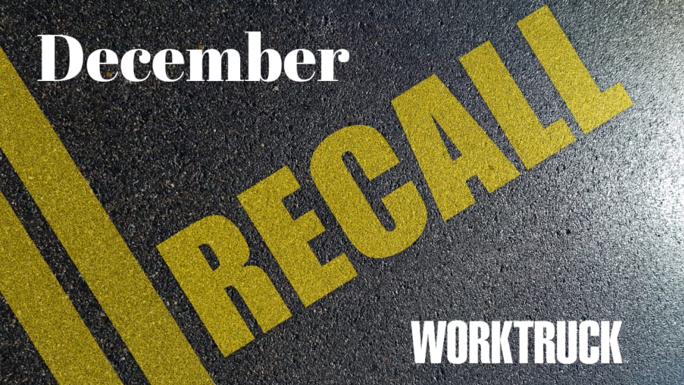Pavement background with double yellow lines and large text that says Recall, December, and Work Truck logo.