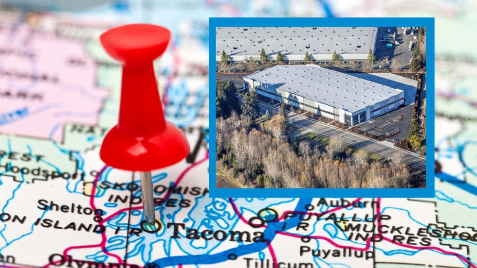Closeup image of map showing Tacoma, Washington, marked with a red pushpin and an inset image of a large industrial building. 