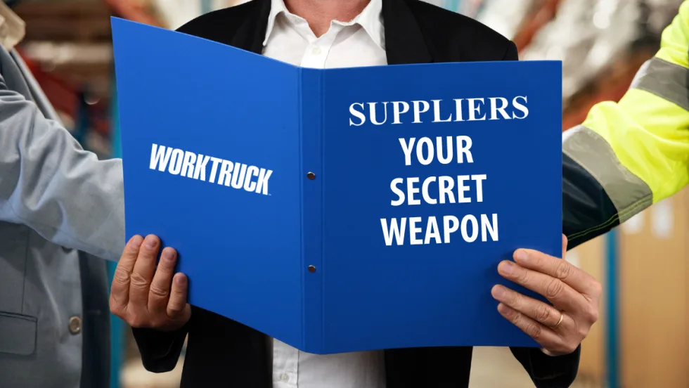 Person holding blue Work Truck folder labeled “Suppliers Your Secret Weapon,” highlighting the importance of vendor partnerships in fleet disaster preparedness