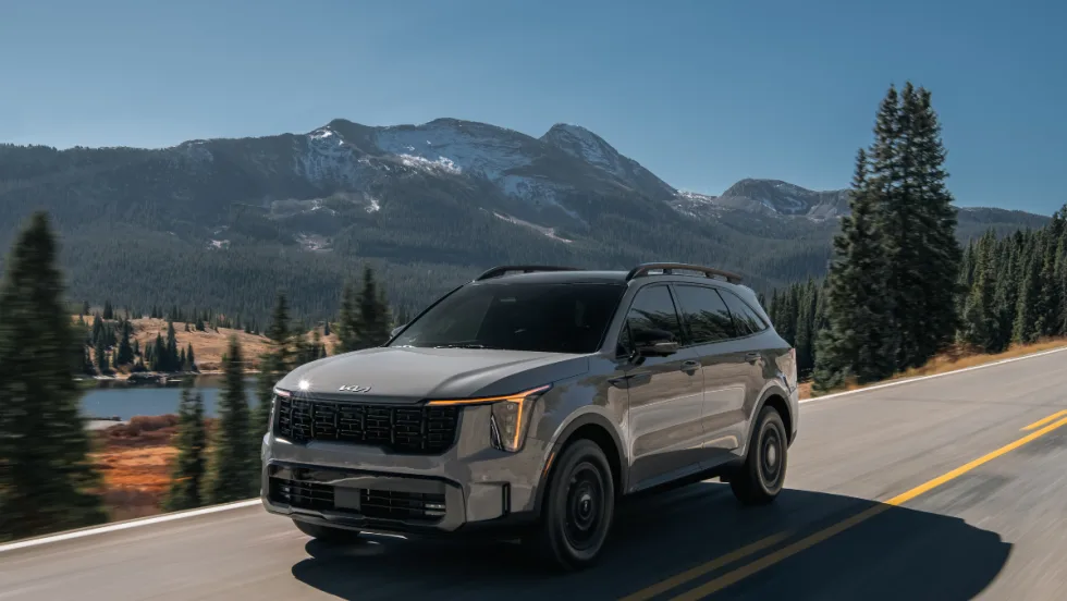 The 2026 Kia Sorento drives mountainside. 