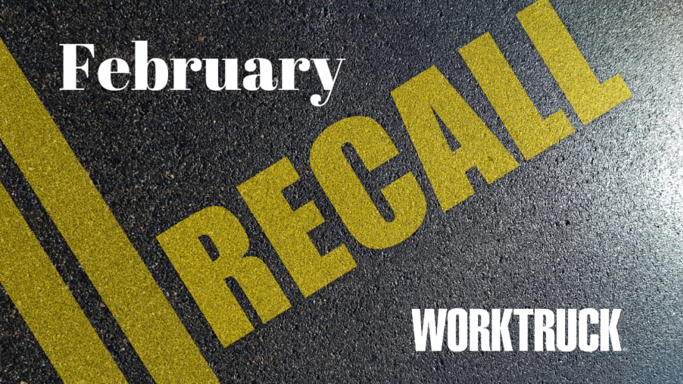 Pavement background with double yellow lines and large text that says Recall, February, and Work Truck logo.