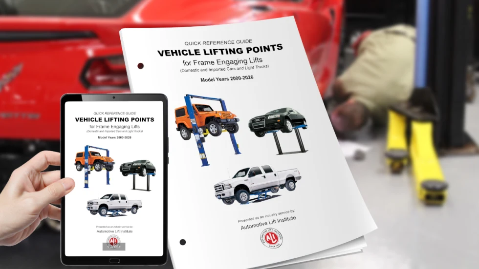 Photo of ALI Lifting Points Guide in digital and print form with background setting of a car on a lift.