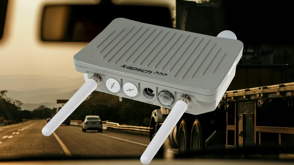 Radio communication device with two small antennas against a background image of highway traffic. 