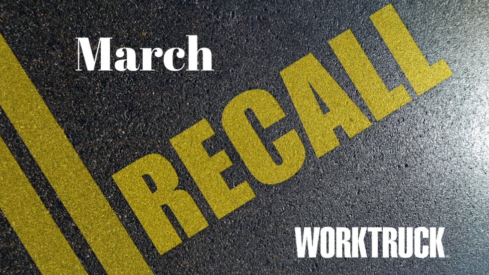 Pavement background with double yellow lines and large text that says Recall, March, and Work Truck logo.