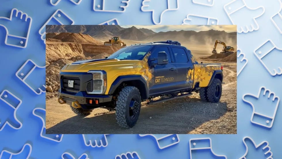 Yellow and black Cat-branded pickup truck with off-road tires parked at a construction site, with excavators and a bulldozer working in the background.