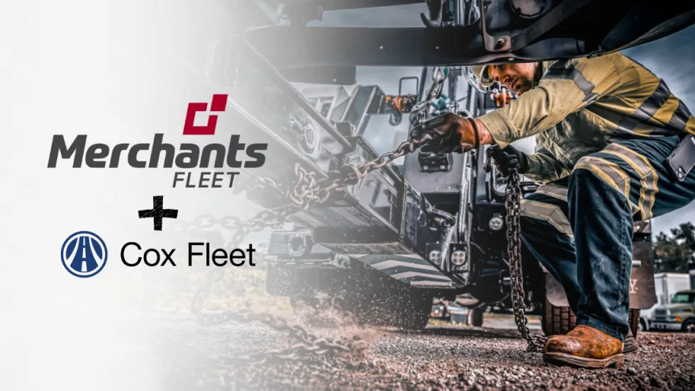 Technician securing chains on a work truck as Merchants Fleet and Cox Fleet announce an expanded partnership to support nationwide fleet maintenance and roadside service operations.