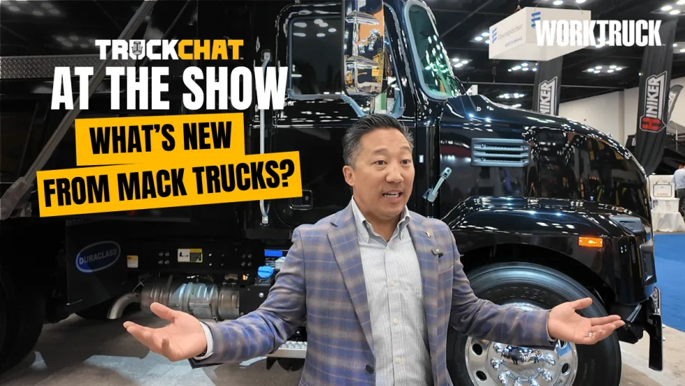Truck Chat at the Show, What's New From Mack Trucks, Alex Lee stands in front of Mack Granite