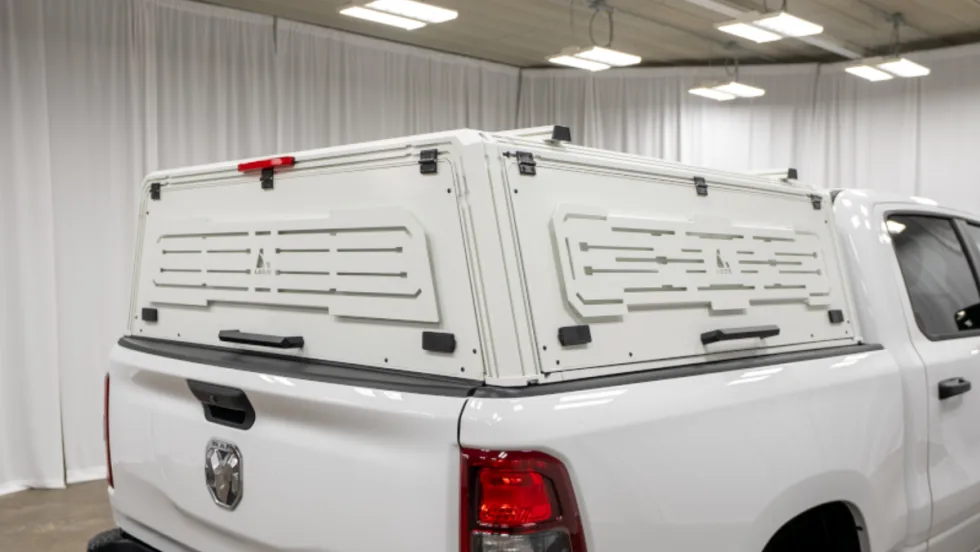 White truck cap cover installed on a white pickup truck. 