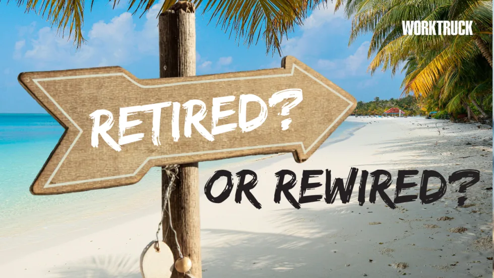 Beach with sign that says retired or rewired from Work Truck