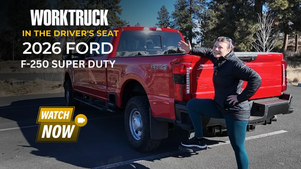 Woman stepping into a red 2026 Ford F-250 Super Duty in a parking lot, highlighting entry height and driver accessibility for a heavy-duty work truck.