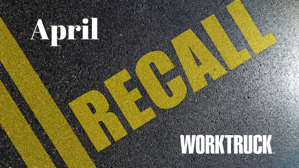 Pavement background with double yellow lines and large text that says Recall, April, and Work Truck logo.