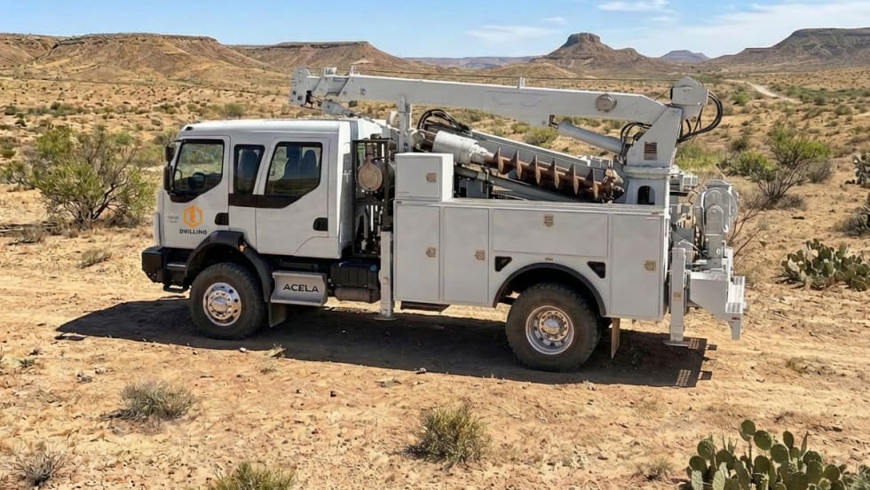 White off-road utility truck in the desert.