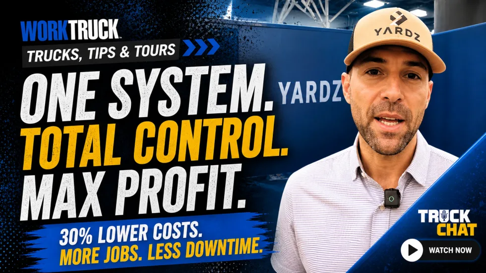 Man at YARDZ booth with bold text promoting fleet management benefits and cost savings.