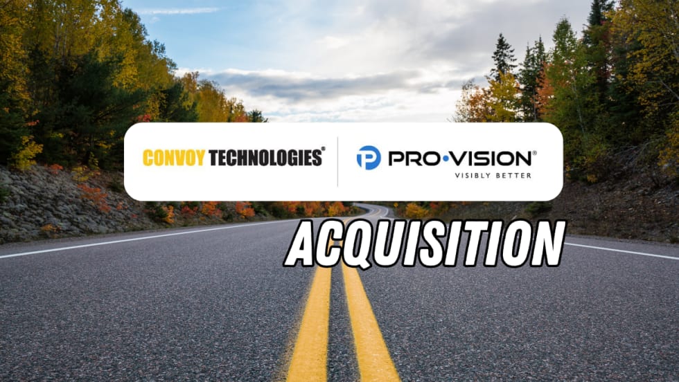 Graphic announcing the acquisition of Pro-Vision by Convoy Technologies over a scenic two-lane road surrounded by autumn trees. Company logos appear above large “Acquisition” text centered on the roadway.