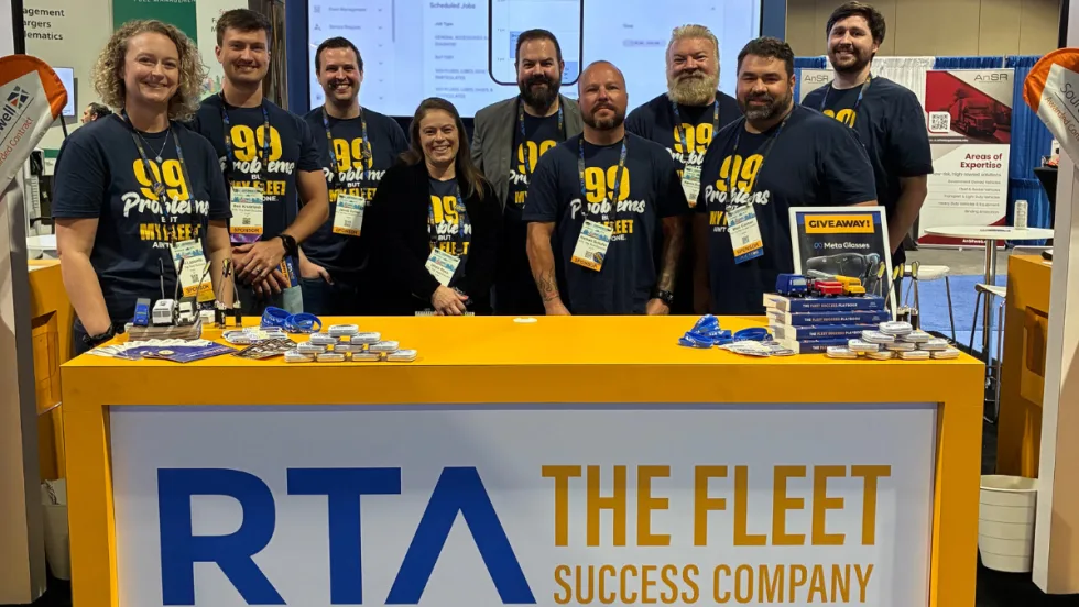 Members of the RTA Fleet team stand behind the company's trade show booth at the 2026 Government Fleet Expo. The display features Fleet360 fleet management software and consulting services, where RTA introduced its new Ron360 conversational AI assistant for fleet operations.