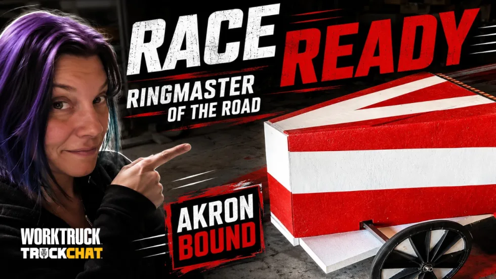 Lauren Fletcher points toward the red-and-white Ringmaster of the Road soap box derby car. Bold text reads “Race Ready,” “Ringmaster of the Road,” and “Akron Bound.”