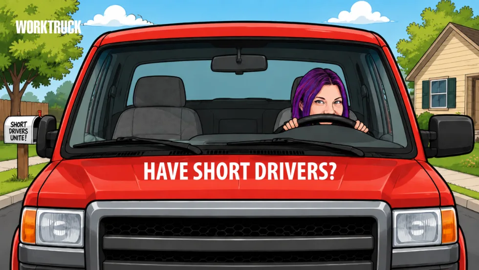 Red pickup truck wiht a shorter driver behind the wheel