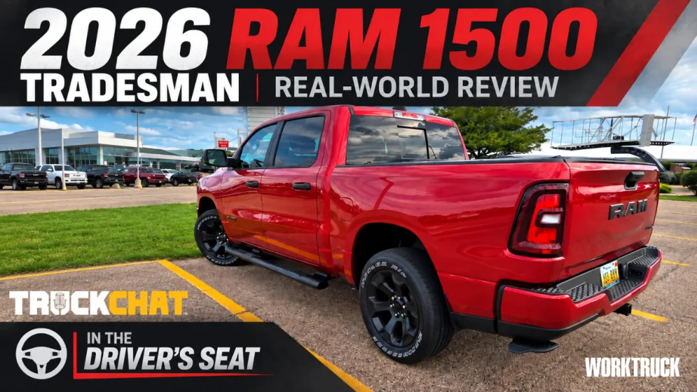 YouTube thumbnail for a Ram pickup review showing a red 2026 Ram 1500 Tradesman parked at an angle in a lot under a partly cloudy sky, with large text reading “2026 RAM 1500,” “TRADESMAN,” “REAL-WORLD REVIEW,” and “In the Driver’s Seat.”