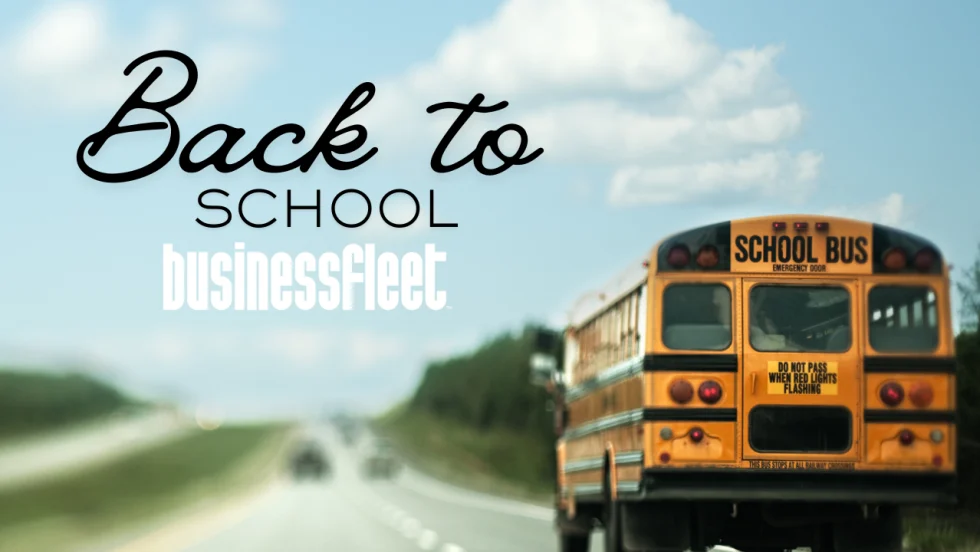 Business Fleet back-to-school graphic featuring a yellow school bus traveling on a highway under a blue sky.
