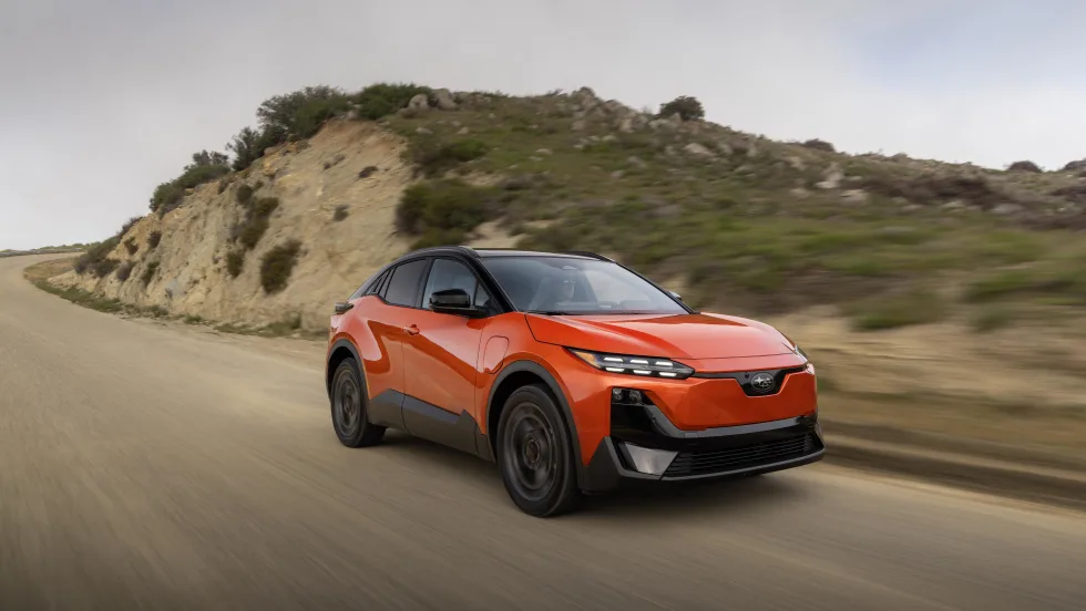 A 2027 red subaru uncharted drives down a road