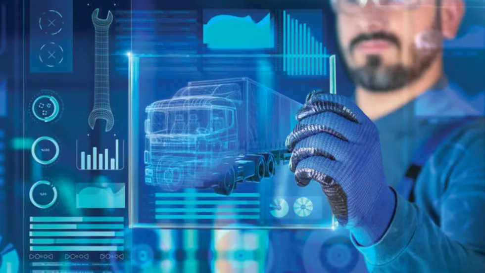 Blue page with a man holding a high tech screen that shows a truck