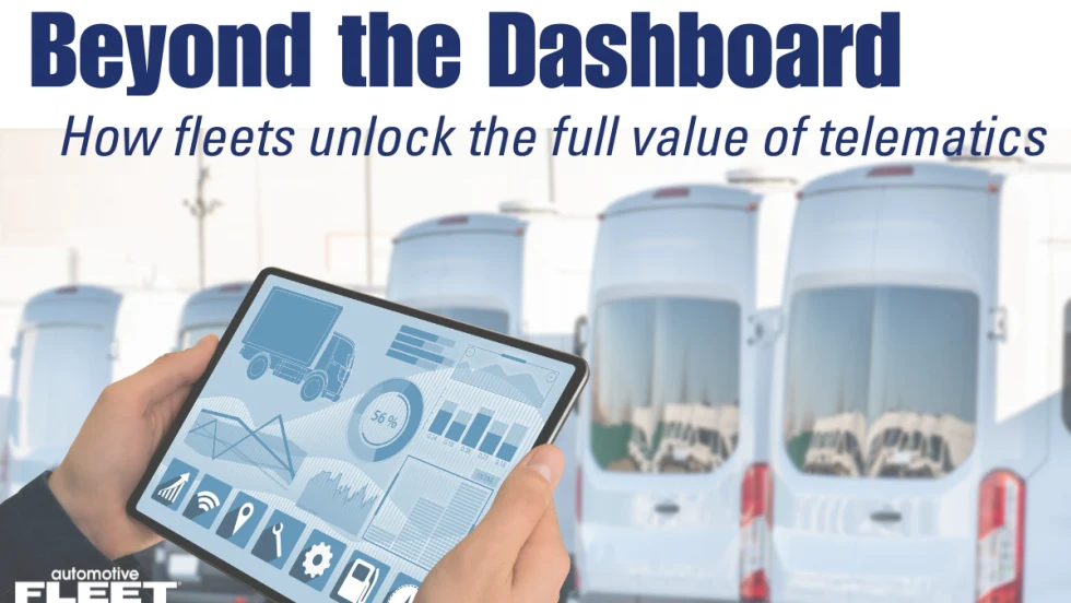 Tablet displaying fleet telematics analytics in front of commercial vans, illustrating how fleet operators use vehicle data to improve safety, efficiency, and performance.