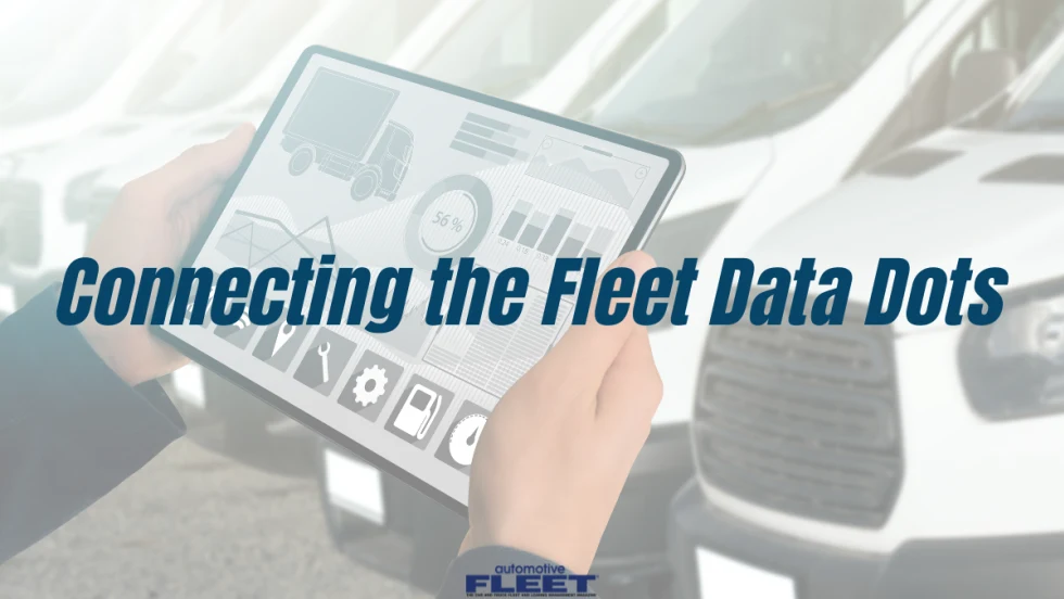 A fleet technical holding an ipad with a maintenance dashboard
