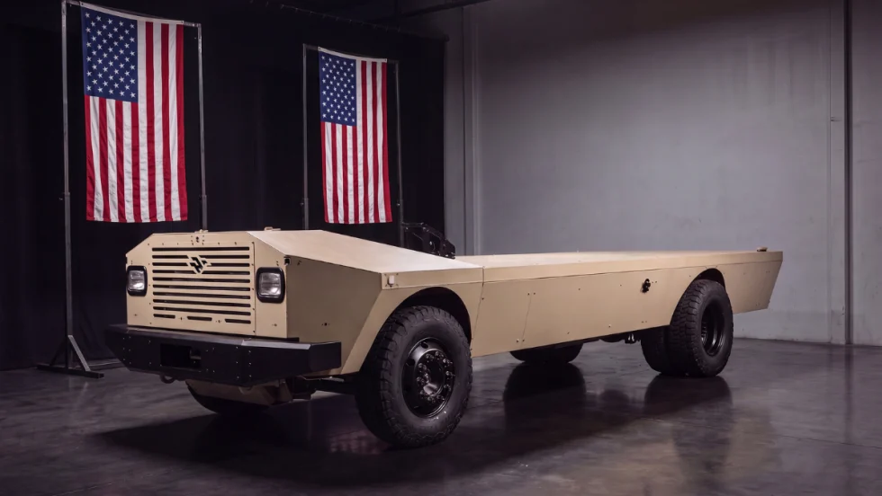 A cream-colored flat vehicle platform that looks like the bottom half of a truck.