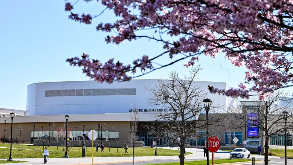 Cherry blossoms frame James Madison University's Atlantic Union Bank Center in Harrisonburg, Virginia, host site for the Mid-Atlantic Advanced Transportation Summit & Expo (MAATSE).