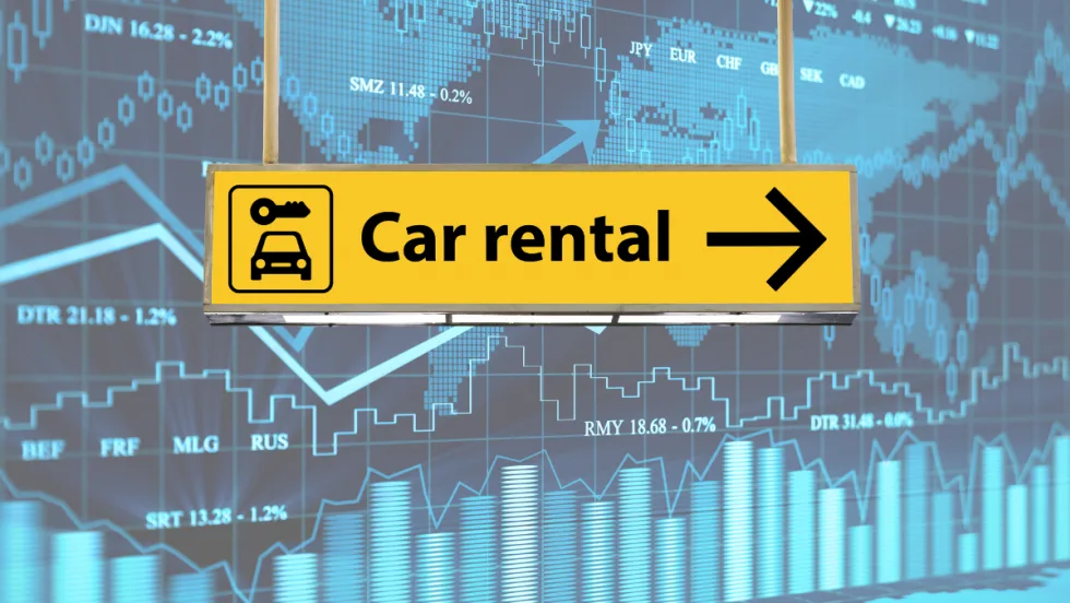 Car rental sign with financial graph in background