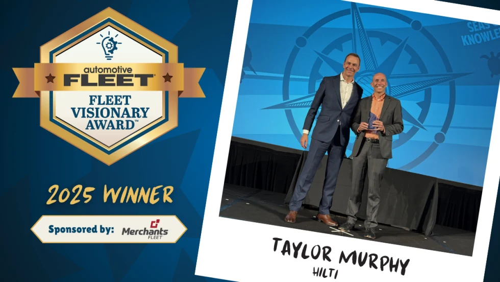 fleet manager accepting award on stage.