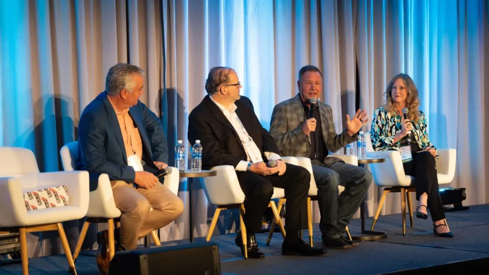 Panelists on stage at CAR conference.