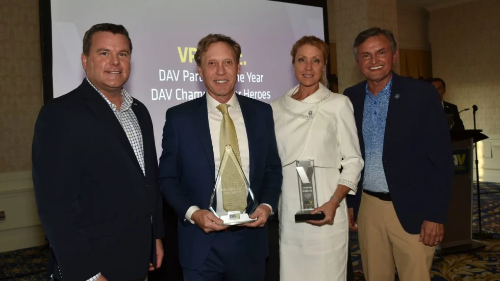 Award winners holding plaques at national DAV awards ceremony.
