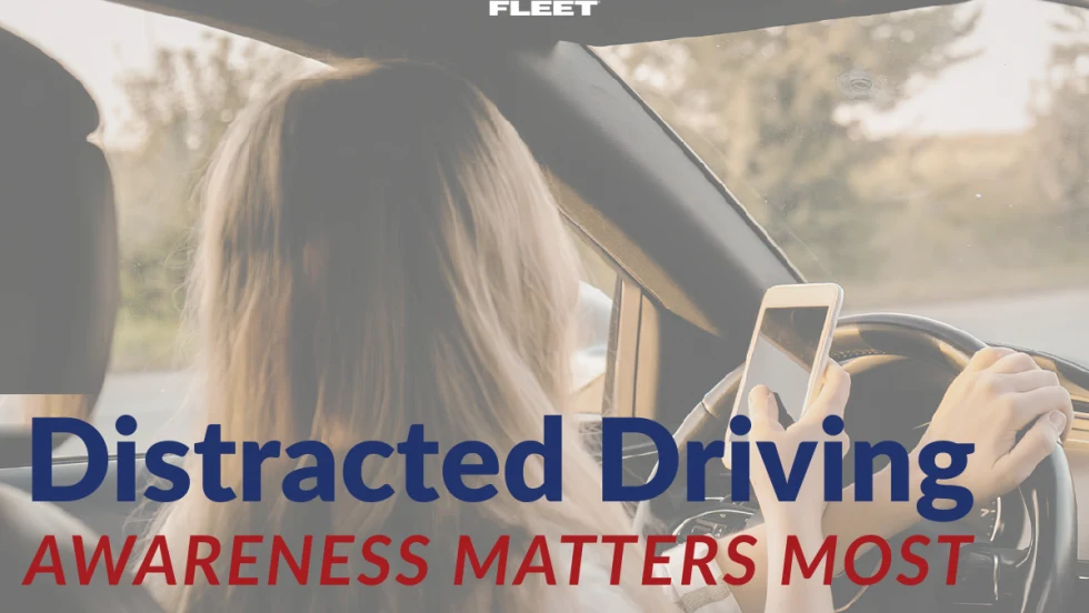 Driver holding a phone while steering, illustrating distracted driving and the importance of mental awareness and attention on the road for fleet safety.