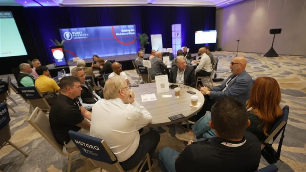 Fleet Forward session participants are pictured, watching the stage.