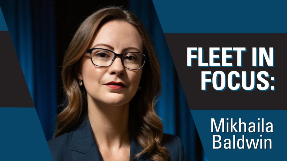 A professional portrait of Mikhaila Baldwin in a blue, white, and black graphic with text reading "Fleet in Focus: Mikhaila Baldwin".