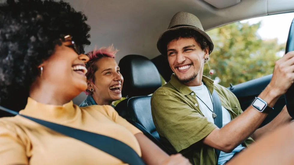 Three Gen Zers are enjoying a rental car.
