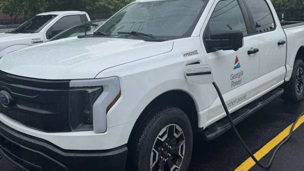 A while Georgia Power Ford F-150 Lightning electric fleet pickup truck being charged.