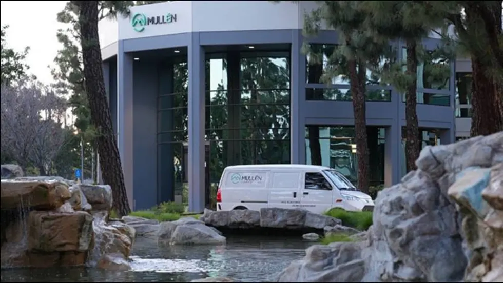 A Mullen Automotive van outside a Mullen facility.