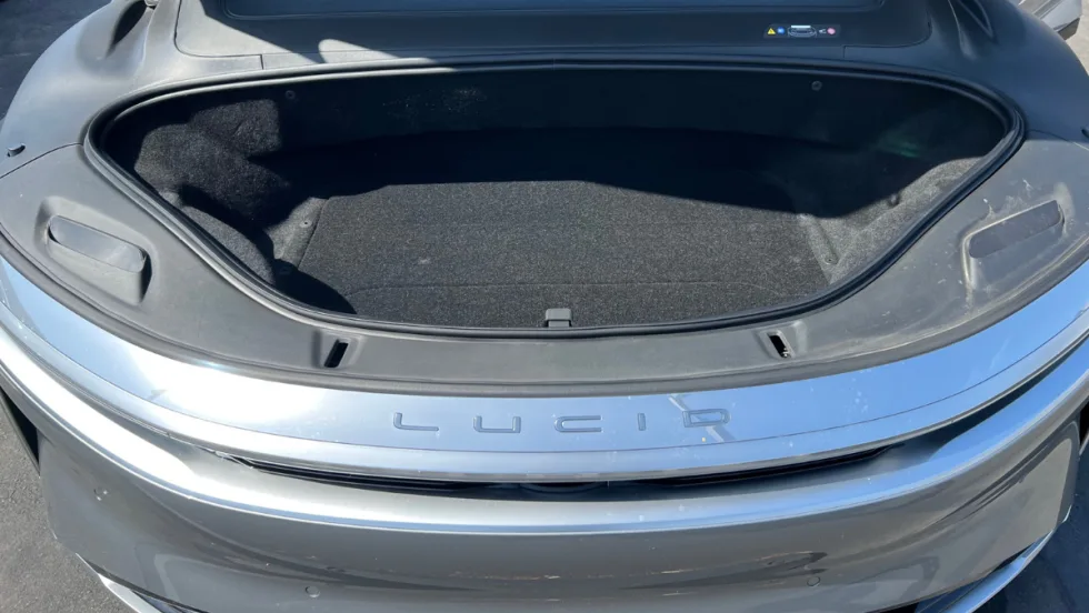 Open front trunk of a Lucid electric vehicle showing additional cargo space.