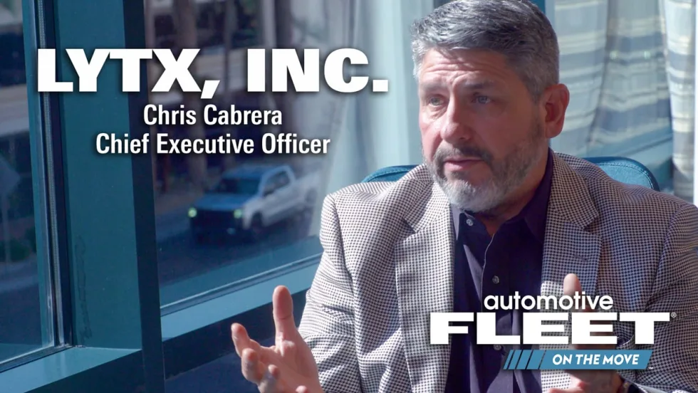 Single shot of CEO being interviewed in title card
