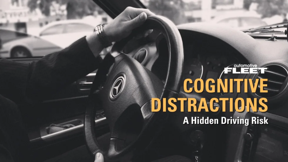Black and white image of hands holding a steering wheel with text reading "Cognitive Distractions: A Hidden Driving Risk".