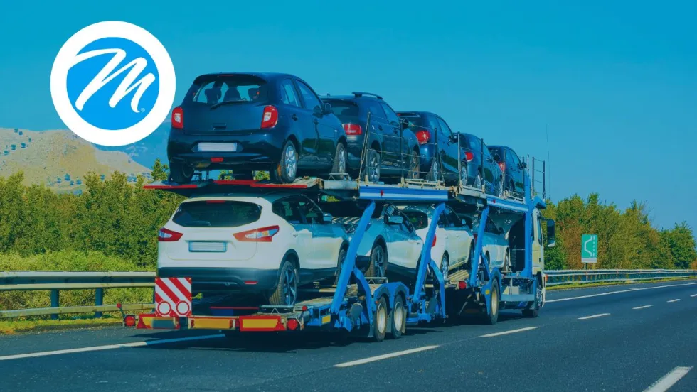 A truck transporting a load of cars.