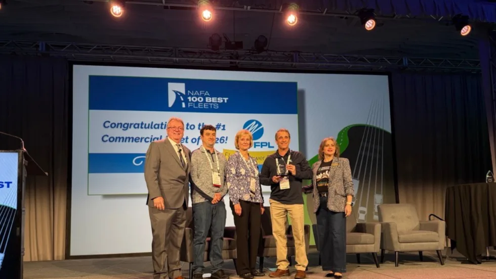 Five award recipients stand on stage at NAFA 2026 I&E in Cleveland as Florida Power & Light is recognized as the #1 Commercial Fleet in the 100 Best Fleets program.