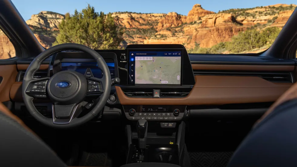 The screen display and driver's side interior of the 2026 Subaru Outback.