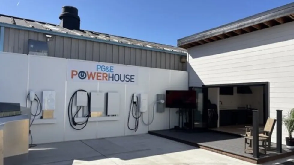 PG&E PowerHouse demo home in San Ramon with wall-mounted EV chargers, batteries, and electric systems, showcasing all-electric home technologies and energy management solutions.