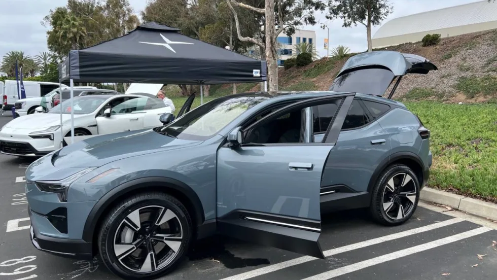 A photo of a gray Polestar hatchback sedan in a parking lot.